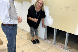 Senior Center Director Brenda Thompson shows post flood repairs made to the Dietert Senior Center in Kerrville Texas