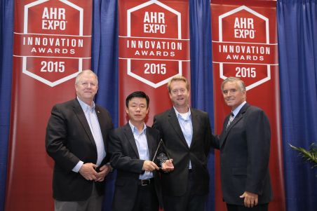 Navien CEO and VP Accept AHR 2015 Innovation Award for NPE S Series Tankless Water Heaters 15 0127